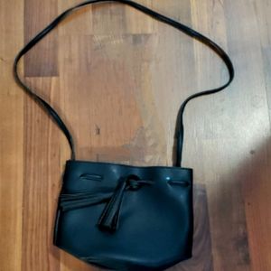 Faux Leather Black Bucket Bag with Tassel Closure